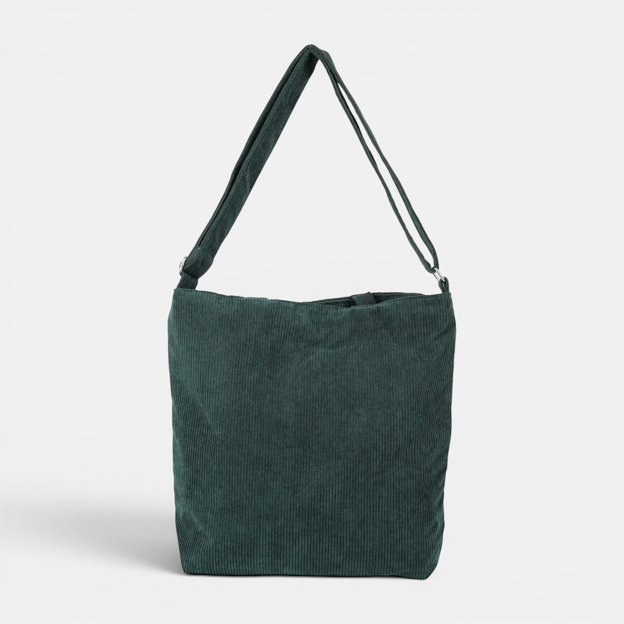 Shalom Living dark green corduroy tote bag with adjustable strap and inner zipper pocket. Can be worn handheld, shoulder, or crossbody.