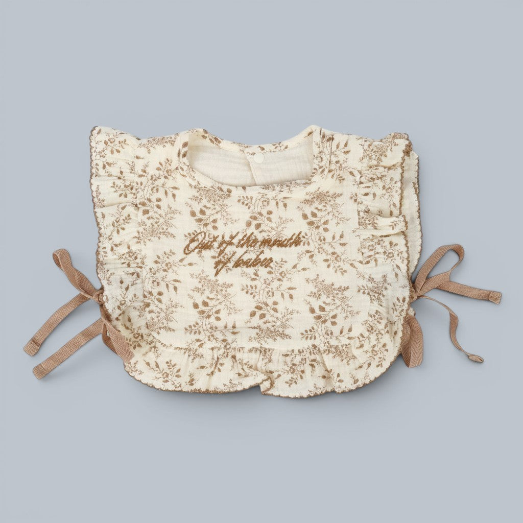 Shalom Living cream cotton ruffle bib with brown floral print and