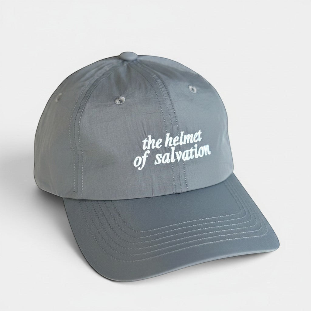 Shalom Living grey lightweight adjustable outdoor cap with "the helmet of salvation" embroidered in white.