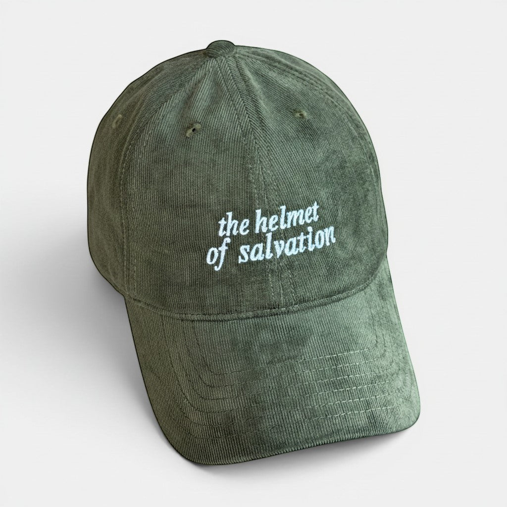Shalom Living olive green corduroy cap with "the helmet of salvation" embroidered in white text. Adjustable adult size.