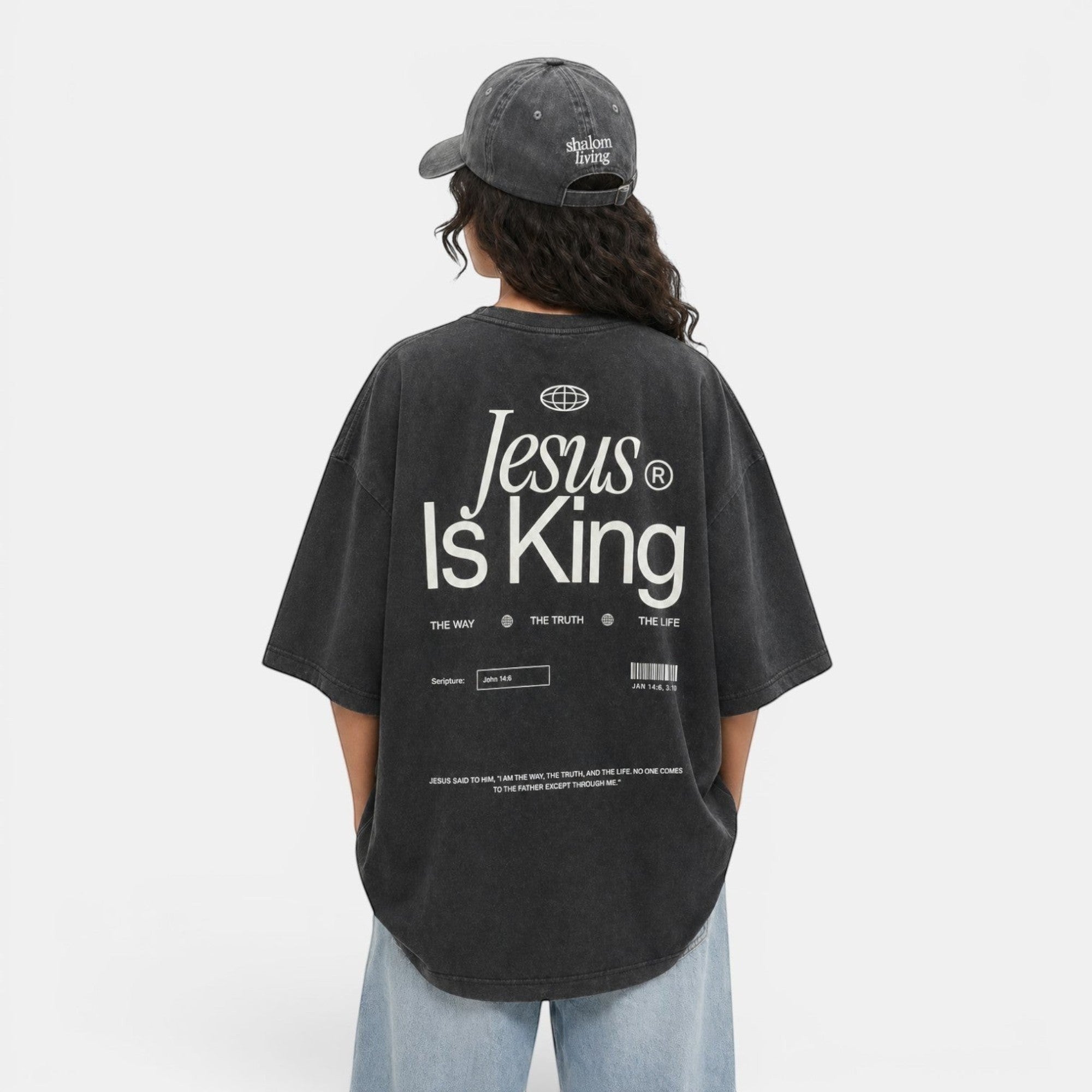 Shalom Living charcoal grey oversized vintage washed cotton t-shirt with "Jesus Is King" graphic print on back.