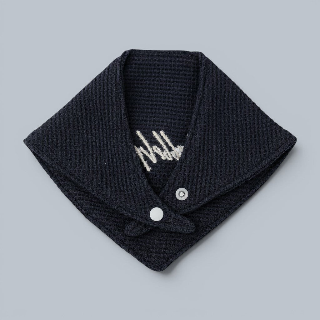 Shalom Living navy blue waffle bandana bib with white snap closure and delicate embroidery.