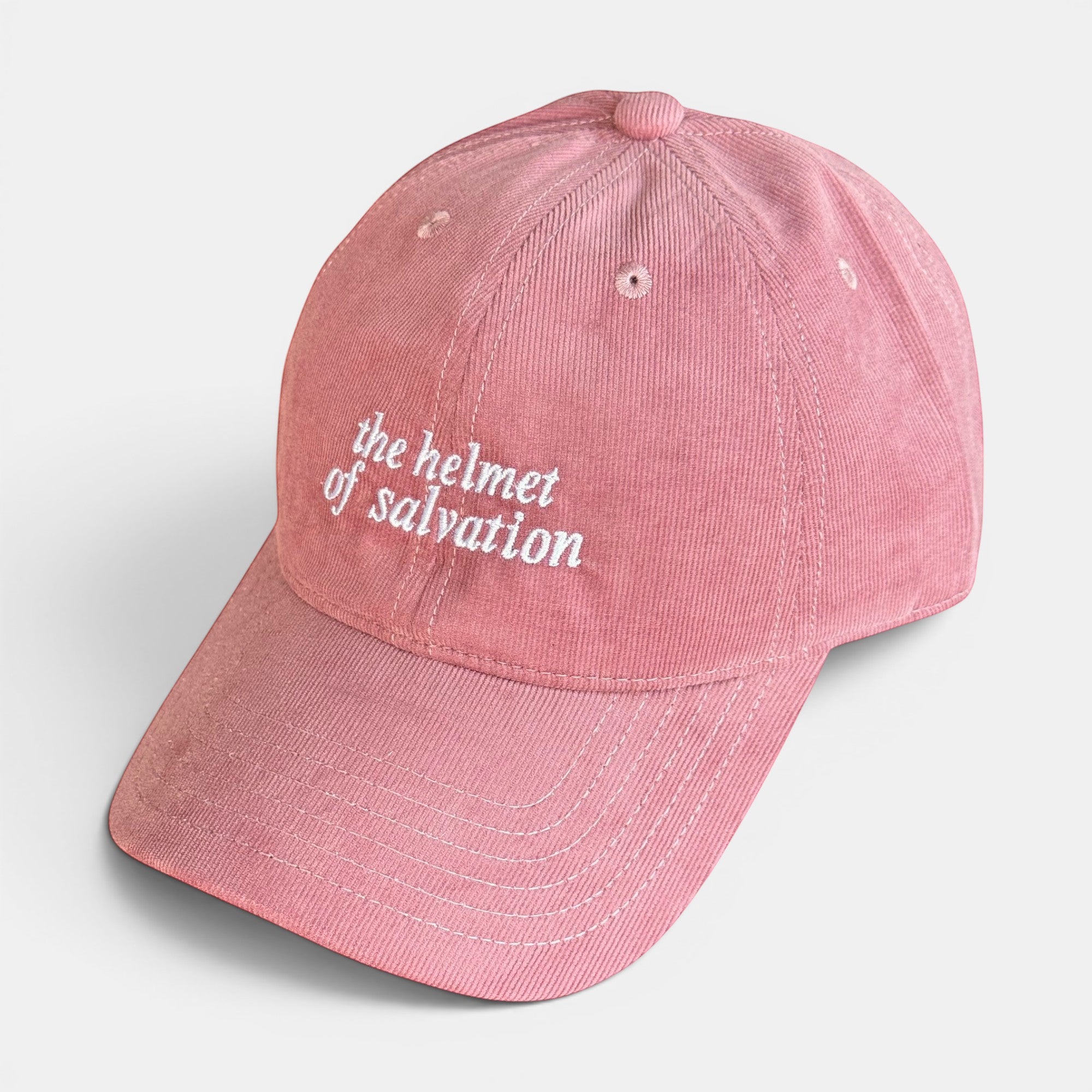 Shalom Living pink corduroy cap with "the helmet of salvation" embroidered in white. Adjustable adult size.