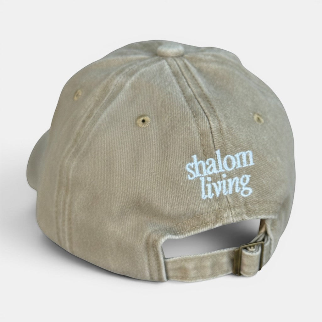 Shalom Living sand vintage washed cotton adjustable cap with embroidered logo and curved brim.