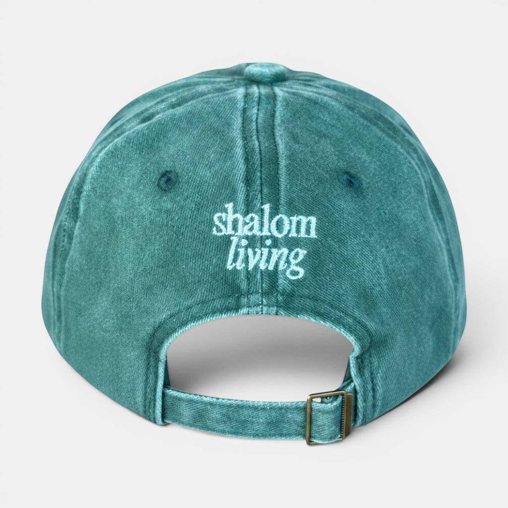 Shalom Living vintage washed green cotton adjustable cap with embroidered text.