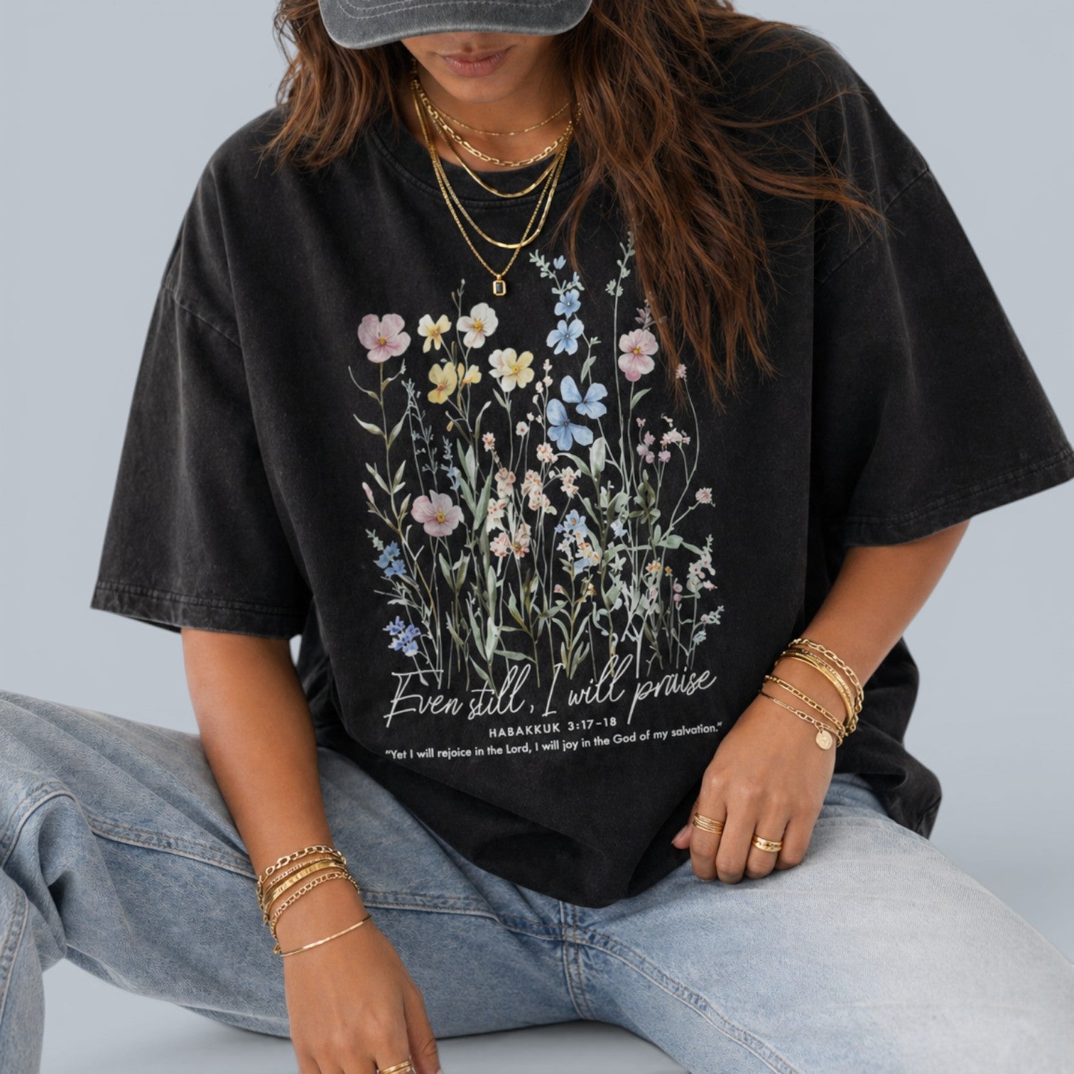 Shalom Living black oversized vintage washed cotton t-shirt with floral graphic and inspirational text "Even still, I will praise."
