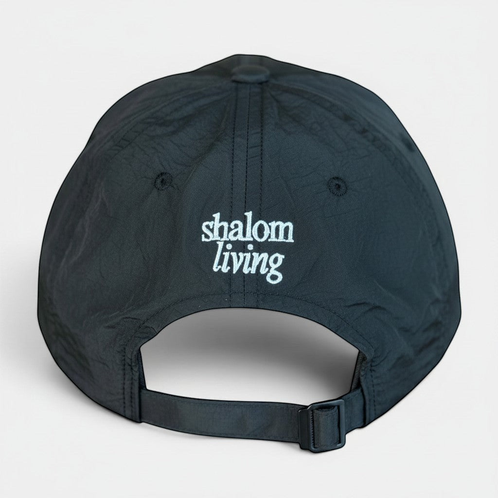 Shalom Living black lightweight adjustable outdoor cap with embroidered logo, breathable and comfortable for daily wear.