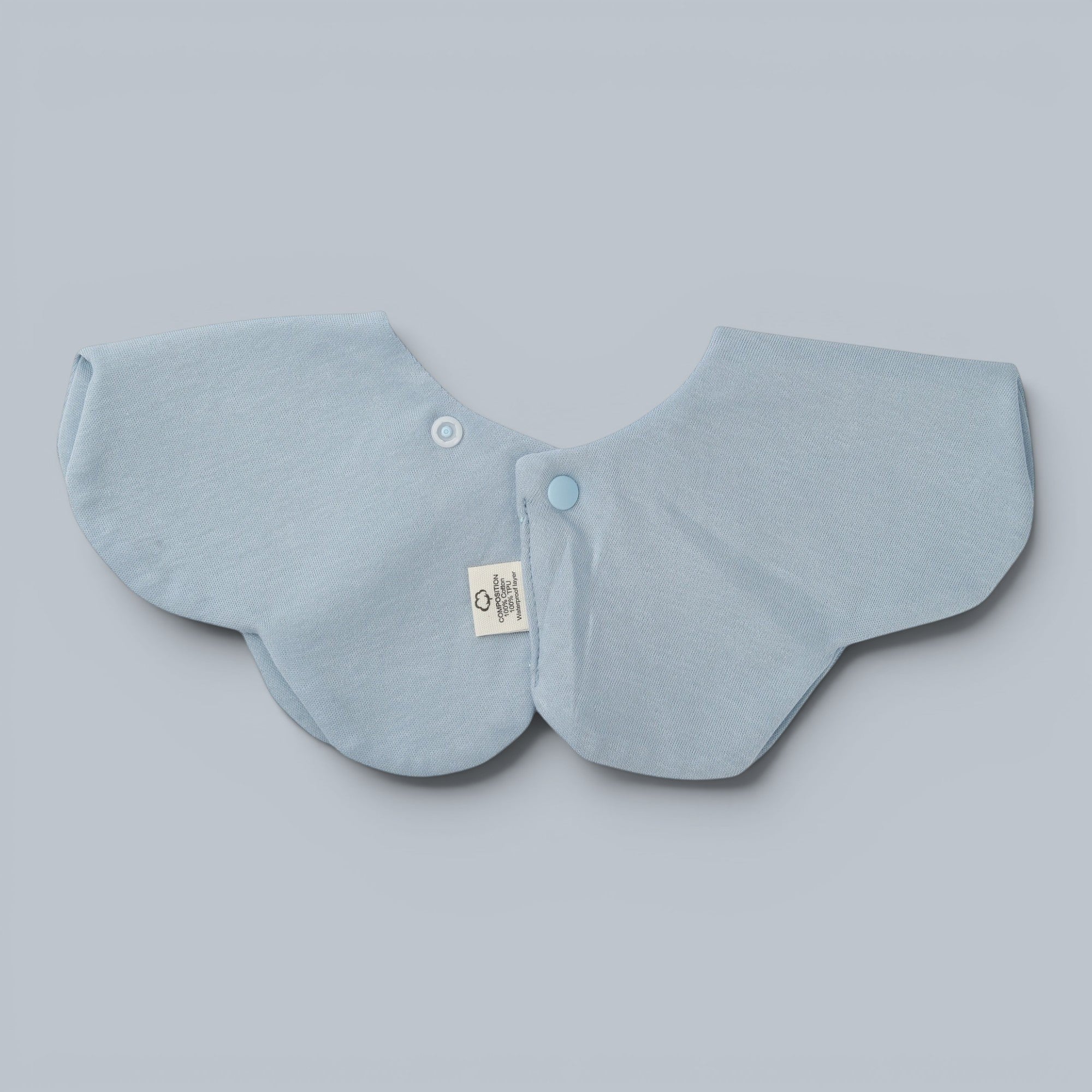 Shalom Living baby bib in light blue with petal shape and "Hallelujah" embroidery. Features snap closure and waterproof layer.