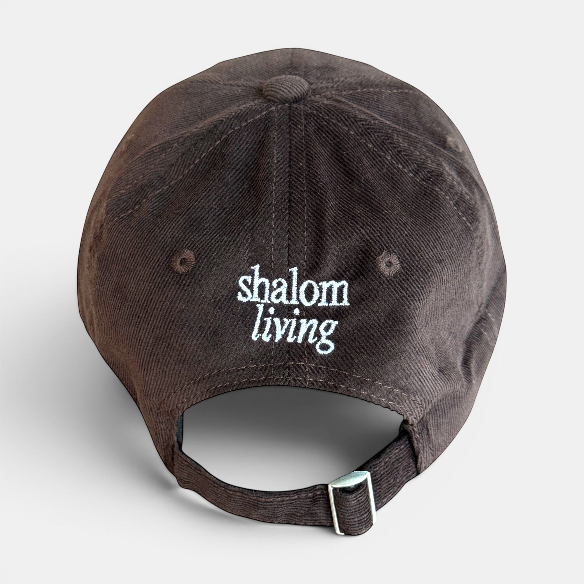 Shalom Living brown corduroy adjustable cap with embroidered text on back.