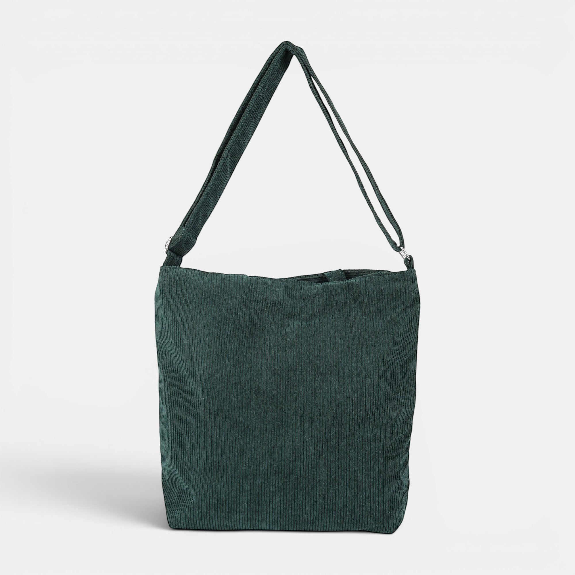 Shalom Living dark green corduroy tote bag with adjustable strap and inner zipper pocket. Can be worn handheld, shoulder, or crossbody.