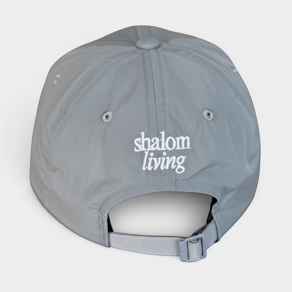 Shalom Living grey adjustable outdoor cap with embroidered logo, lightweight and breathable sports fabric.