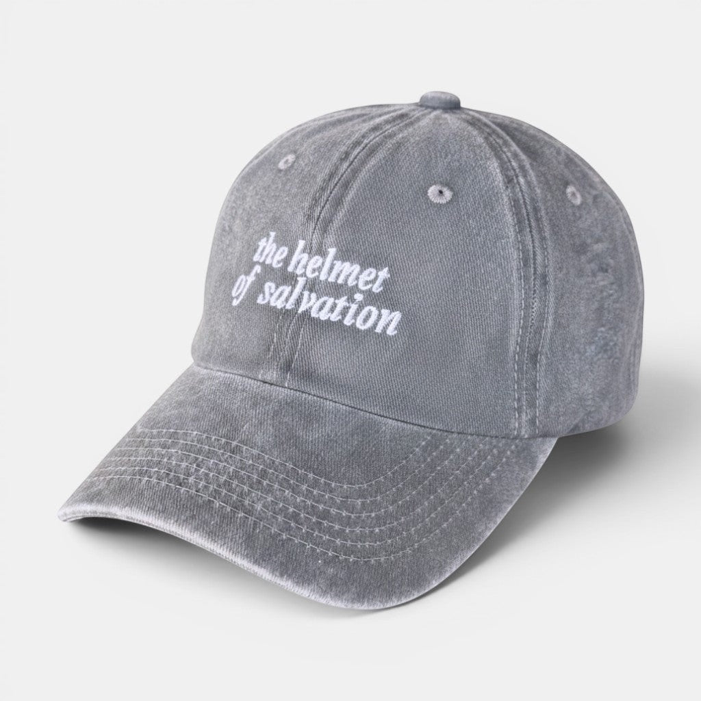 Shalom Living grey vintage washed cotton adjustable cap with embroidered "the helmet of salvation" text.