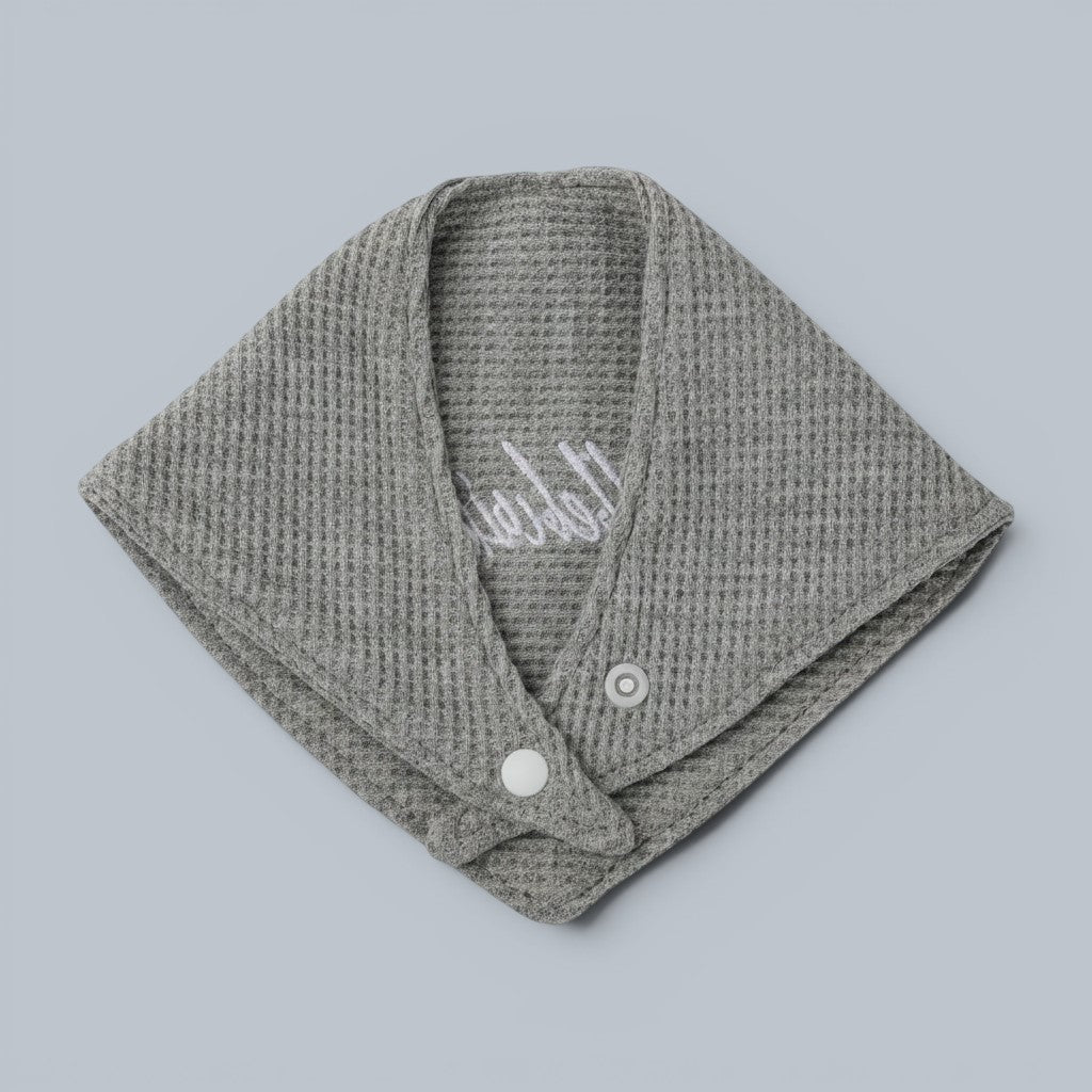 Shalom Living grey waffle bandana bib with "Hallelujah" embroidery and snap closure.