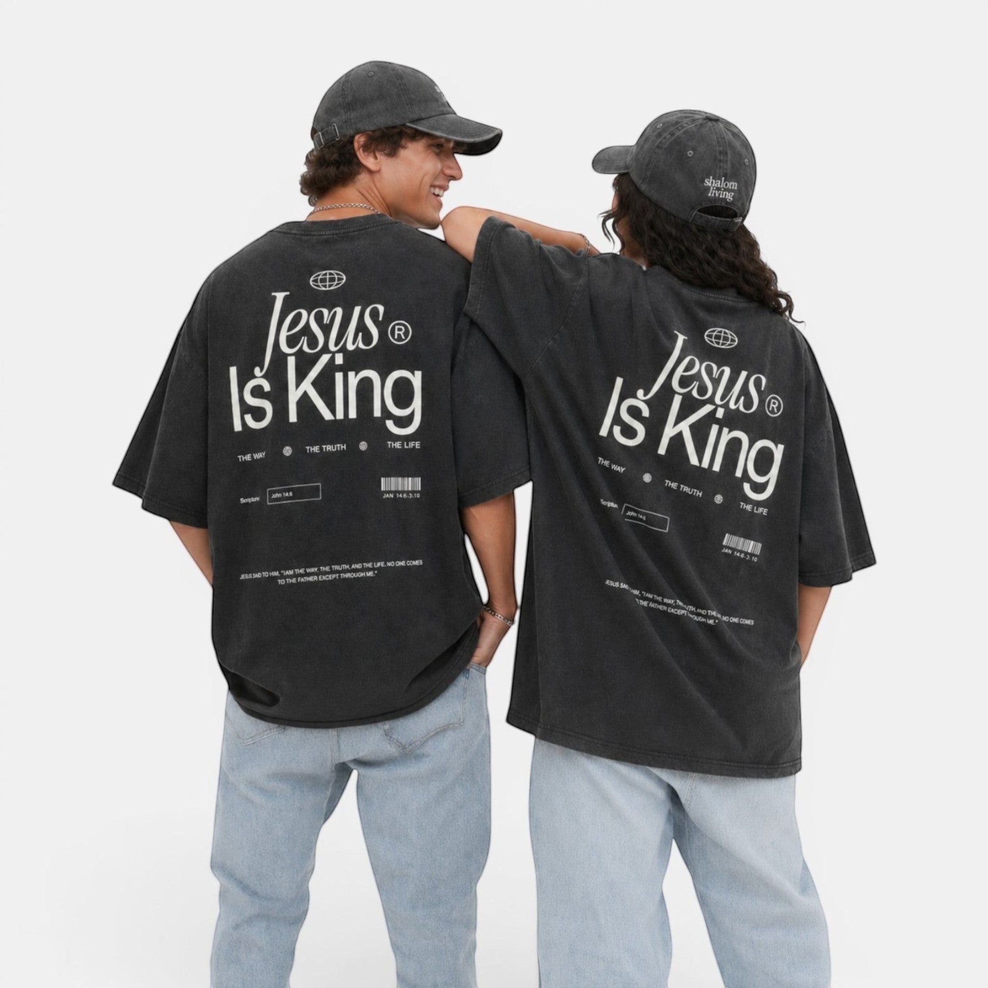Shalom Living charcoal grey oversized vintage washed cotton t-shirt with "Jesus Is King" graphic and distressed details.