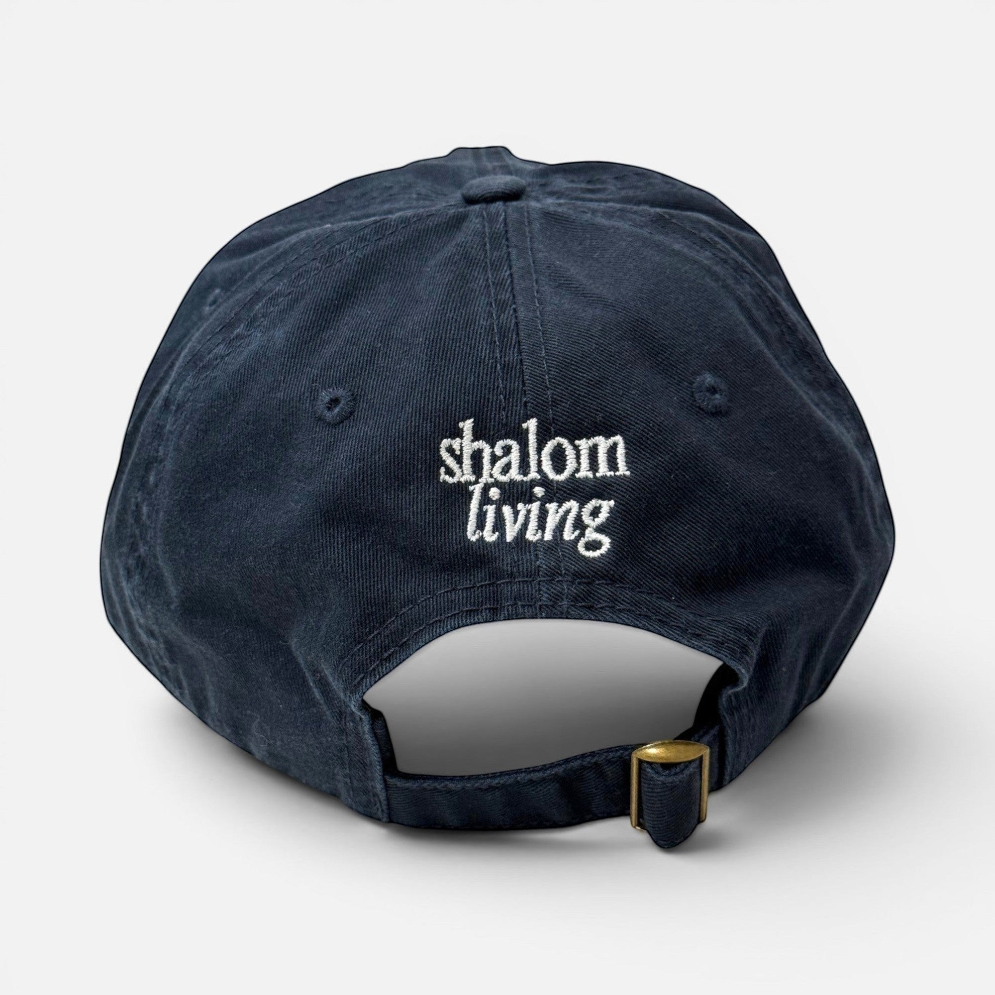 Shalom Living navy cotton XL cap with adjustable back closure and white embroidered brand logo on the back