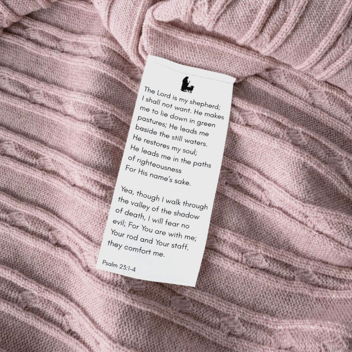 Shalom Living pink cable knit polo featuring a hidden wash tag with Psalm 23:1-4 scripture verse printed inside.