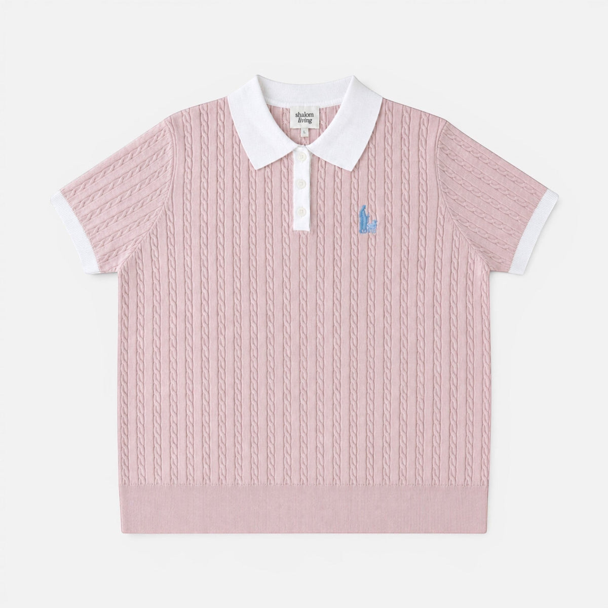 Shalom Living pink cable knit polo shirt with a white collar, button placket, and embroidered shepherd detail.