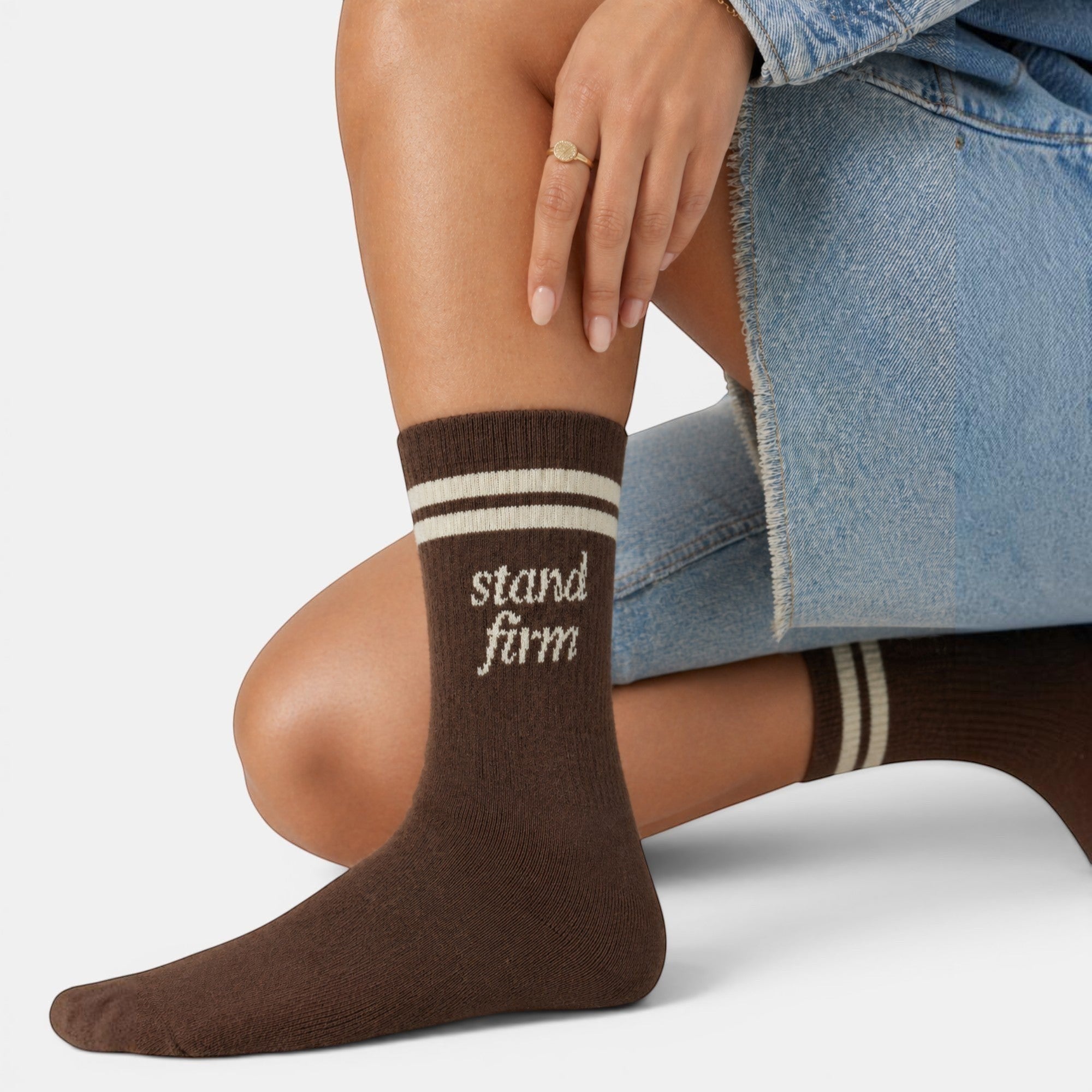 Shalom Living brown cotton crew socks with white stripes and "stand firm" text. Comfortable everyday wear.