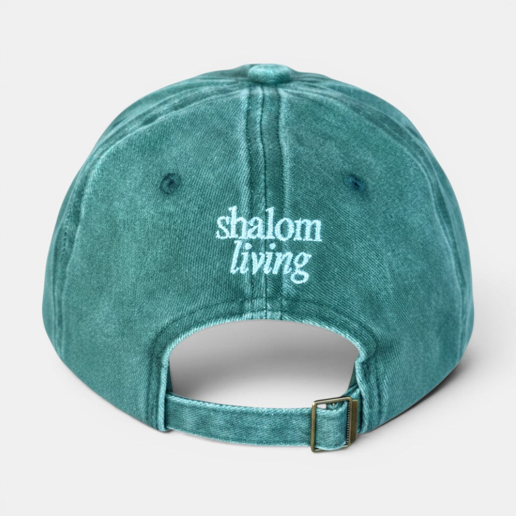 Shalom Living vintage washed green cotton adjustable cap with embroidered text.