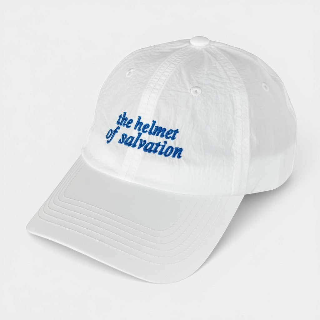 Shalom Living white lightweight adjustable outdoor cap with blue embroidered "the helmet of salvation" text.