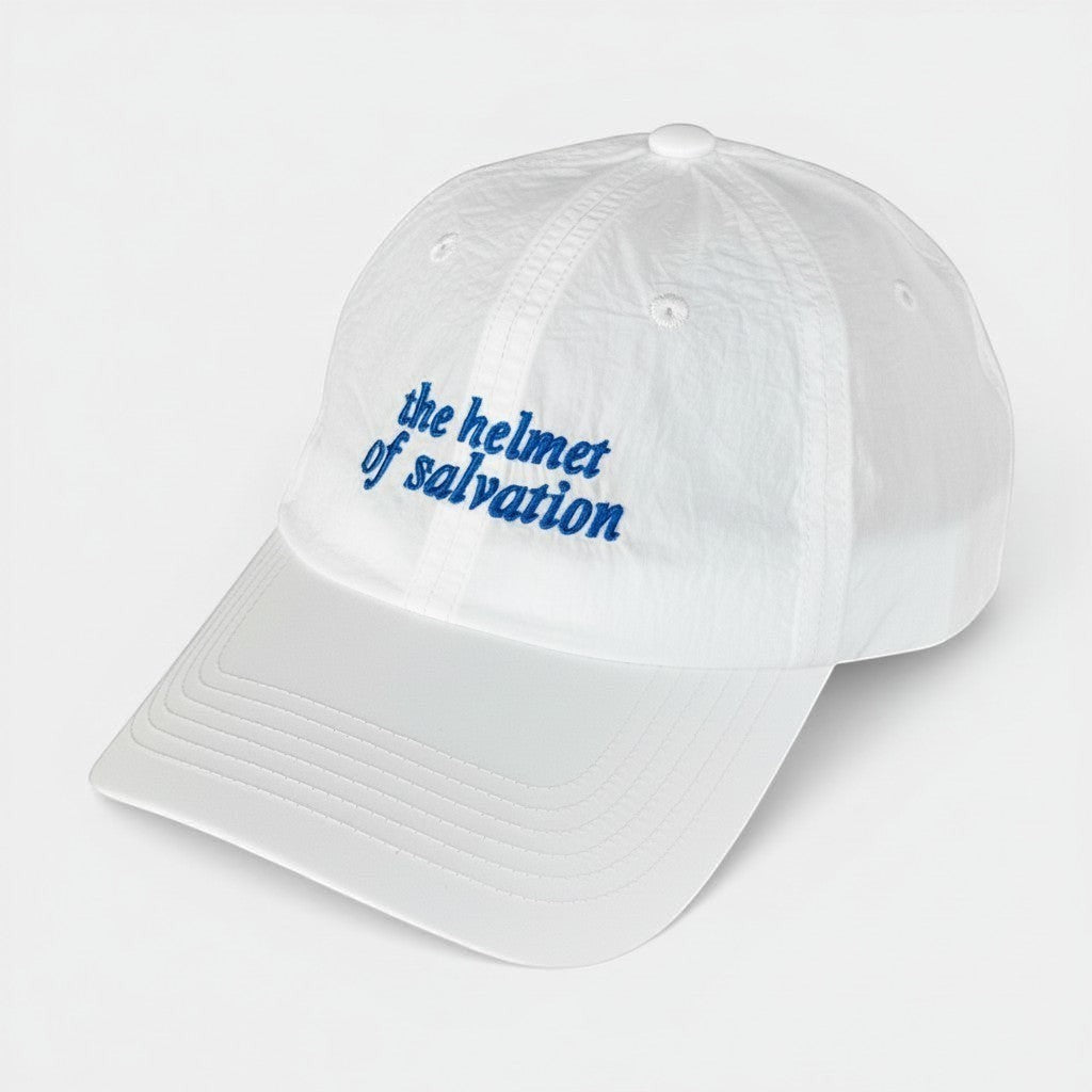 Shalom Living white lightweight adjustable outdoor cap with blue embroidered "the helmet of salvation" text.