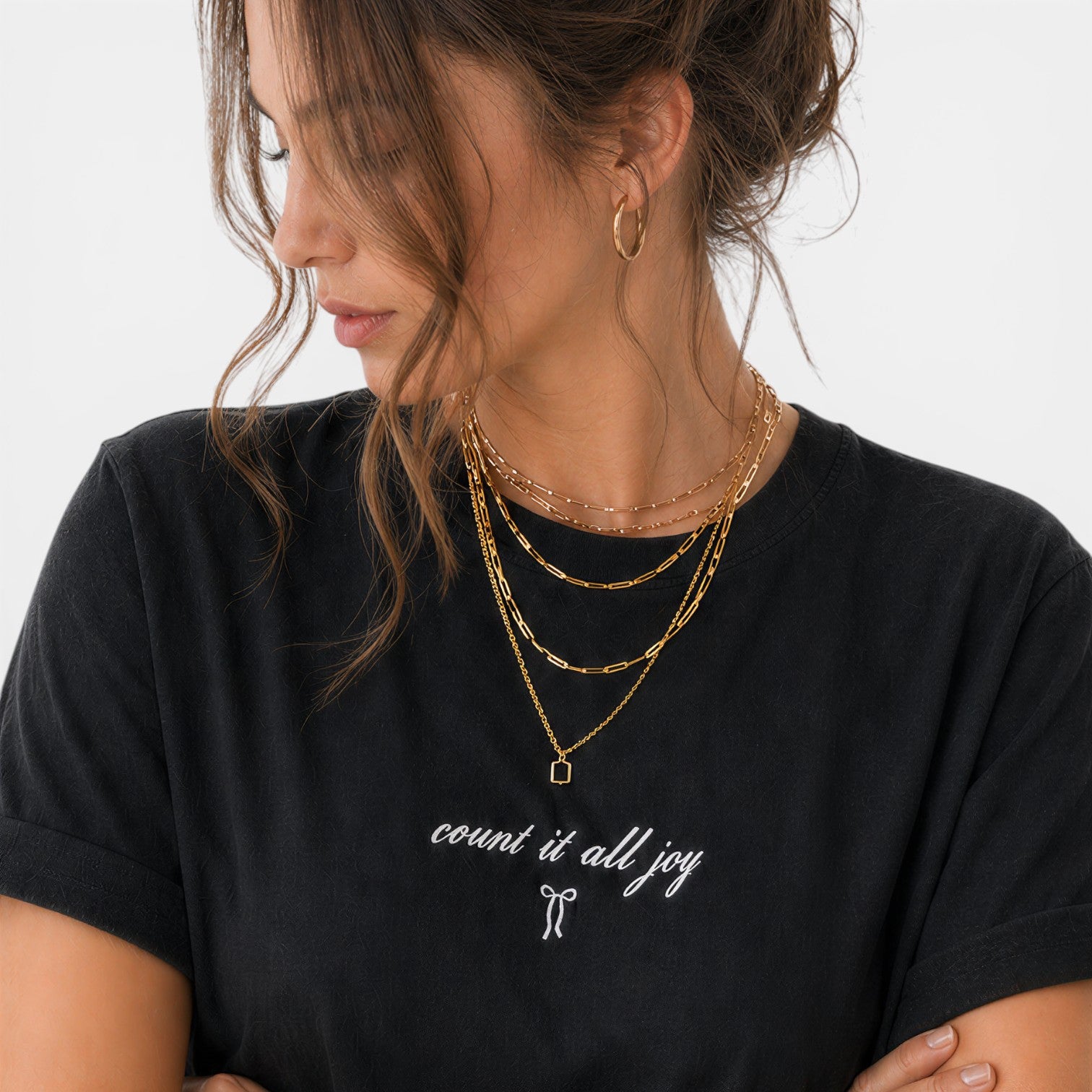 Shalom Living black cotton t-shirt with "count it all joy" embroidered in white script and a small bow graphic.